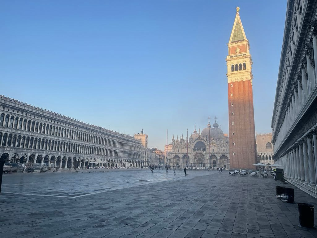 St. Mark's Square at dawn with the Campanile bell tower and St. Mark's Basilica