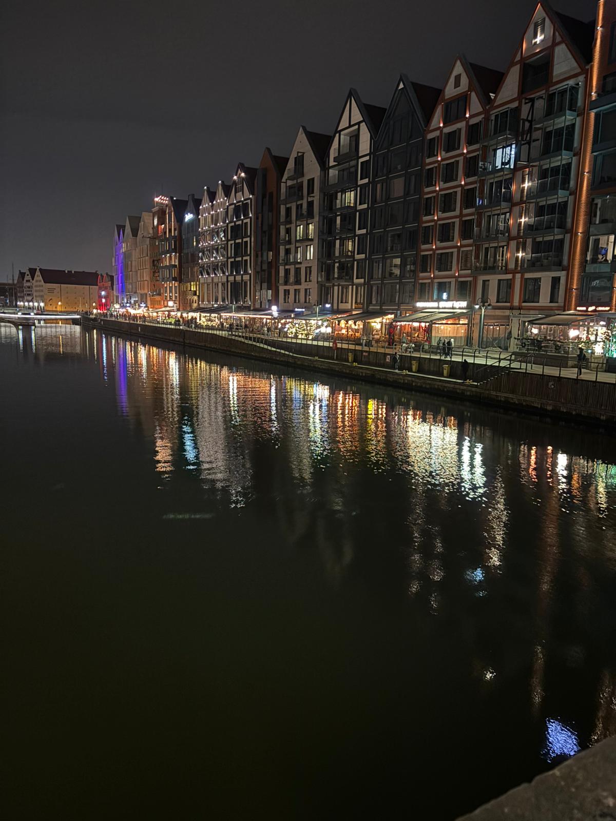 Gdansk riverside at night with reflections on the Motlawa