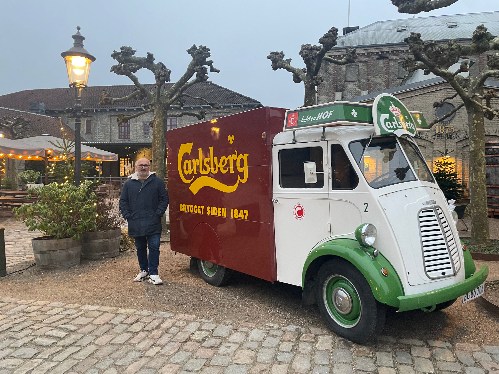 Tony beside a vintage Carlsberg delivery van at the old brewery