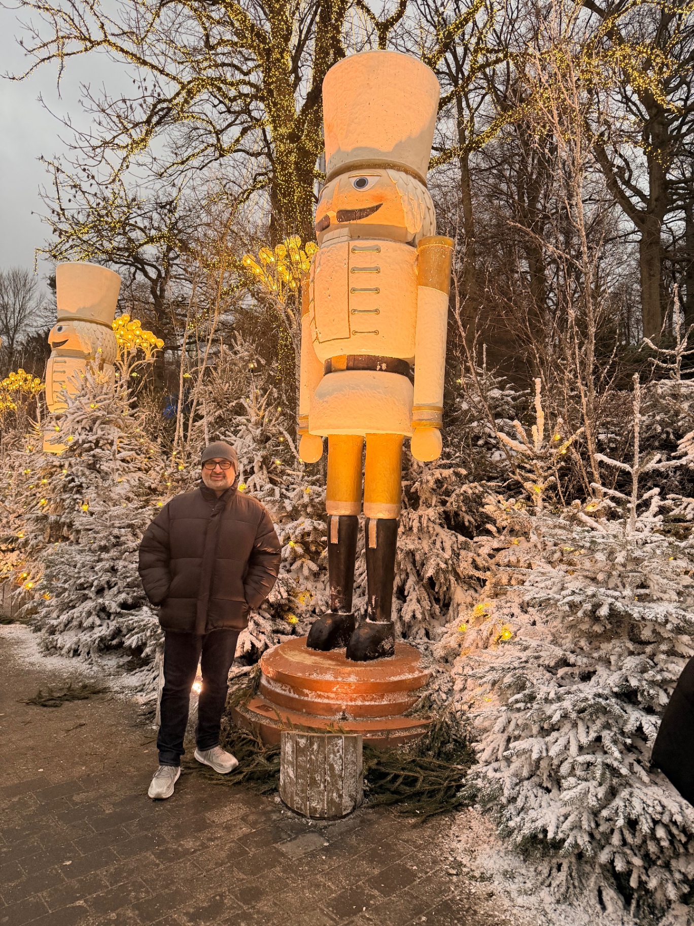 Tony next to a giant illuminated nutcracker at Liseberg