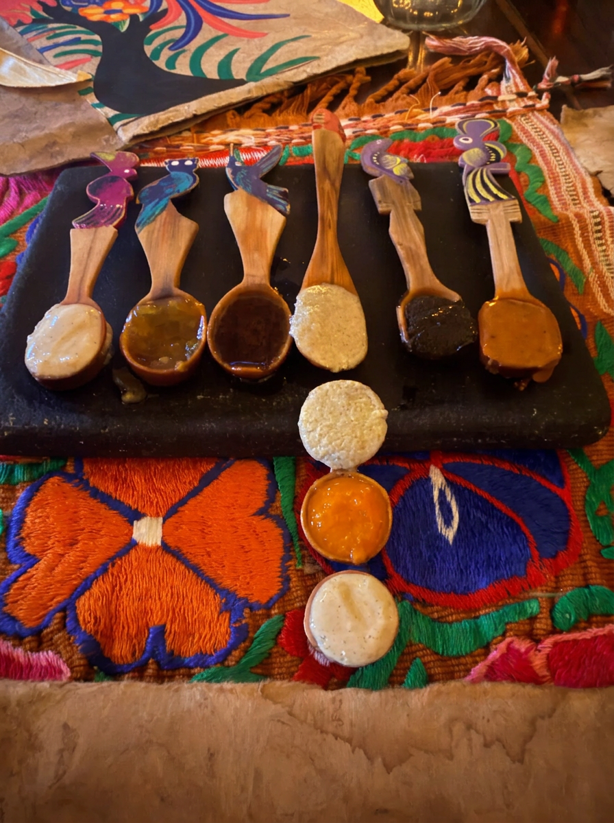 Colourful salsas served on wooden spoons at Cetli